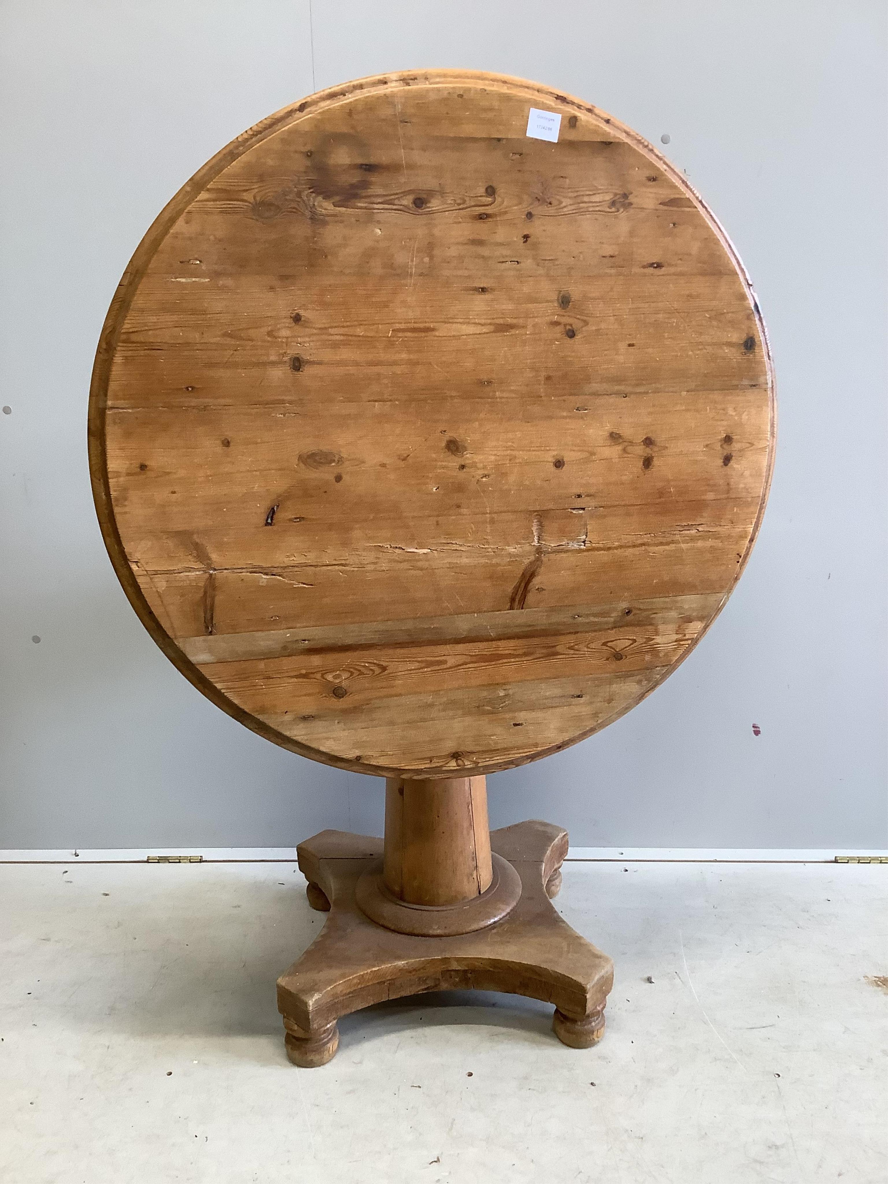 A 19th century Continental pine circular tilt top breakfast table, diameter 92cm, height 72cm. Condition - fair